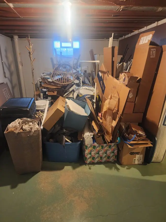 Roll-off dumpster container at job site for 8 Yard Dumpster Rental in Au Sable